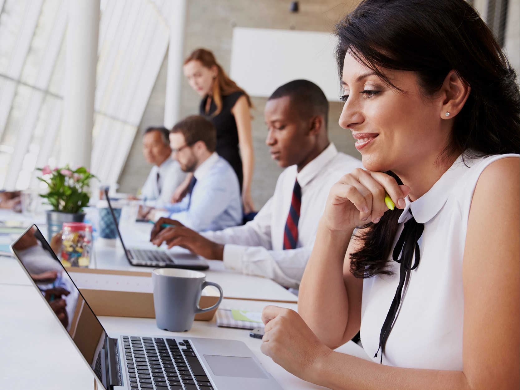 Business professionals working at desks